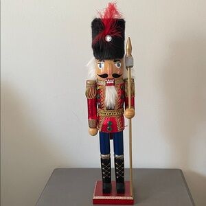 Festive Nutcracker Soldier with Red and Gold Accents